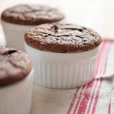 Chocolate Soufflé in white ramekin