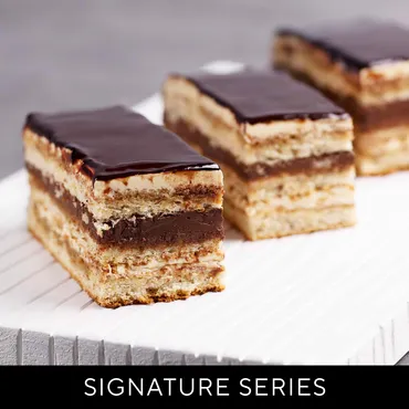 Opera Cakes sliced and topped with chocolate
