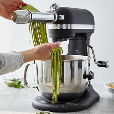 KitchenAid stand mixer in black with pasta cutter attachment